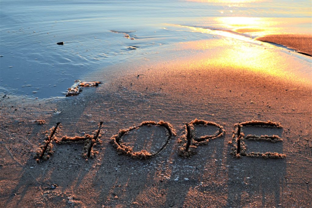Hope written in sand on the beach at sunset! Nominated